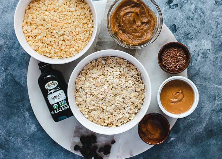oatmeal cookie granola ingredients: oats, crispy rice, date paste, almond butter, flax seeds, cinnamon, vanilla, raisins