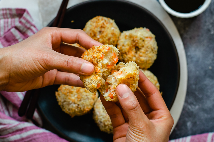 vegan korokke made in air fryer, hands holding korokke and breaking it in half