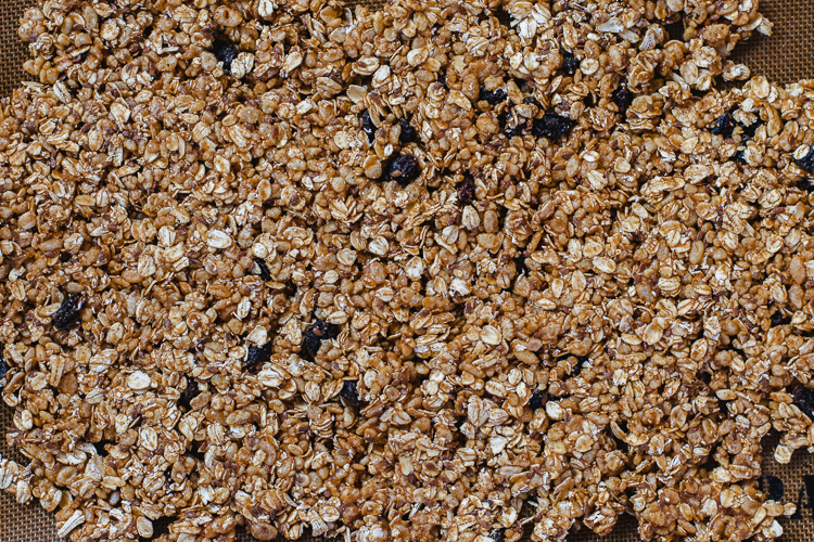 oatmeal cookie granola mixture spread out on tray before baking