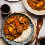 japanese curry in bowls with rice and hot tea on the side