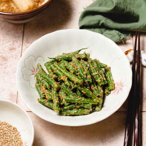 green bean gomaae in a bowl, shot at an angle