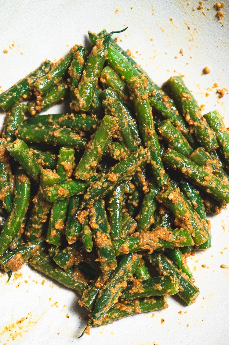 close up of sesame green beans in a bowl