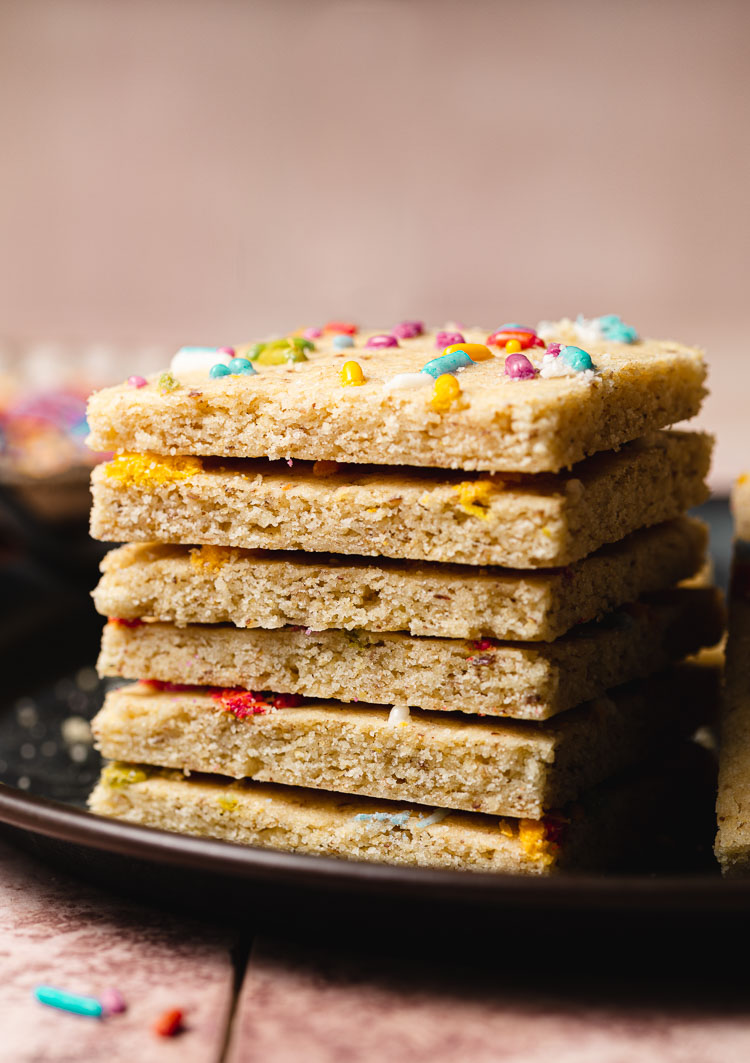 vegan sugar cookie bars stacked on plate