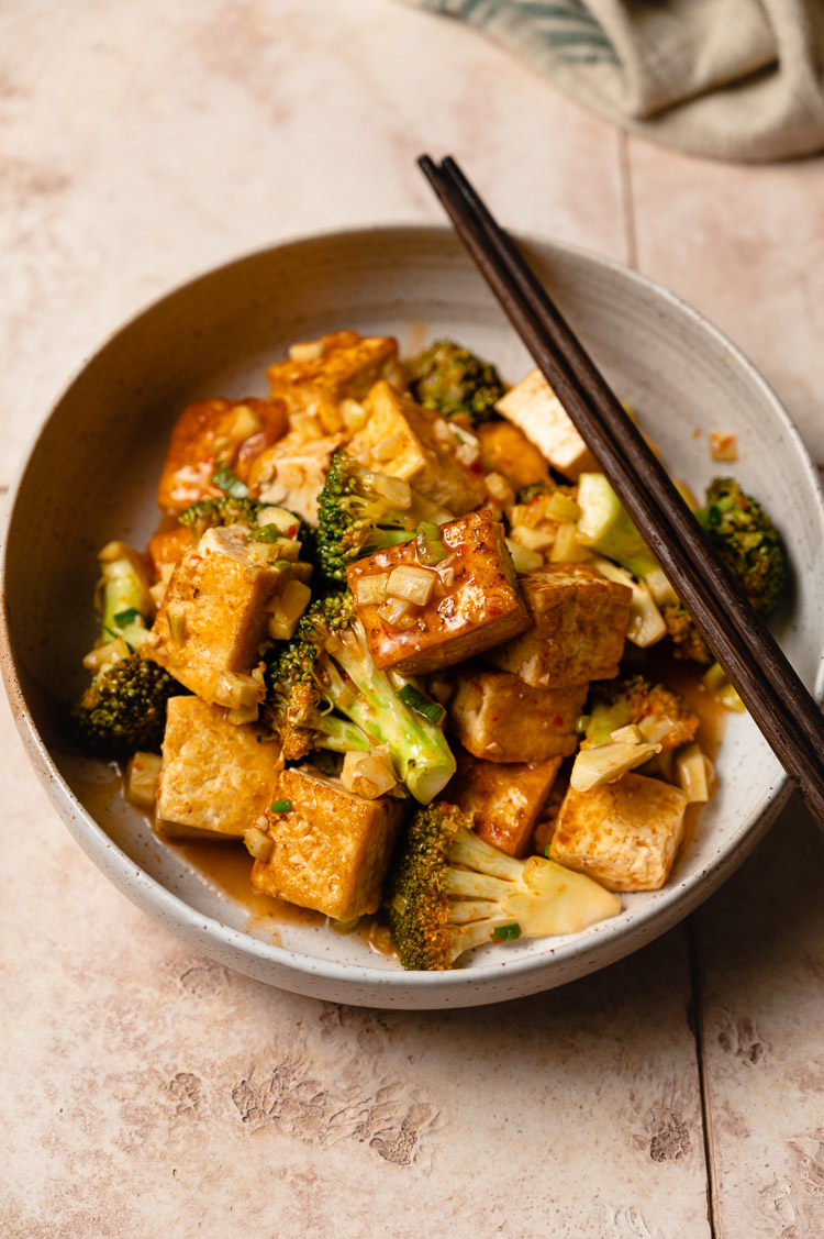 bowl of chili sauce tofu and broccoli