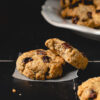 two oatmeal raisin cookies staggered on top each other