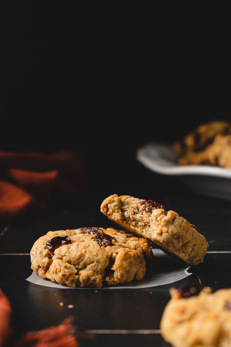 two staggered oatmeal raisin cookies