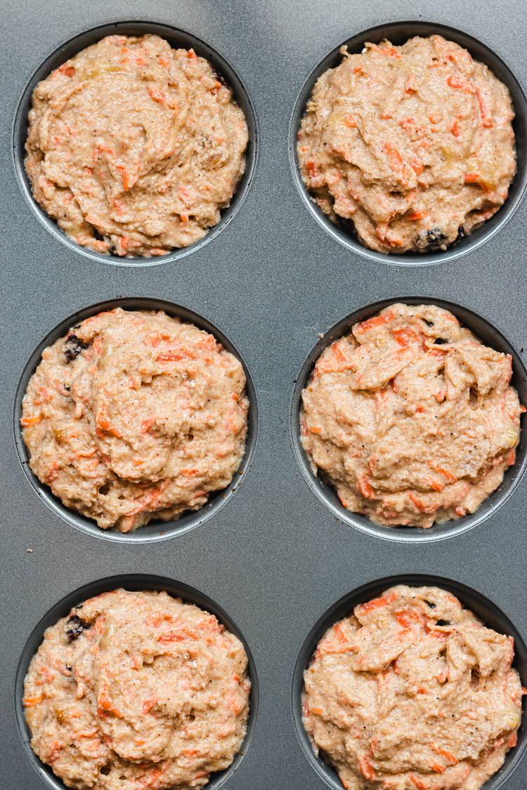 vegan carrot banana muffin batter in tray before baking