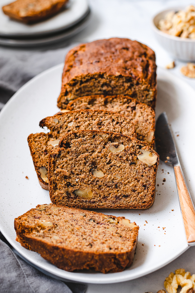 Vegan banana bread slices on a plate.