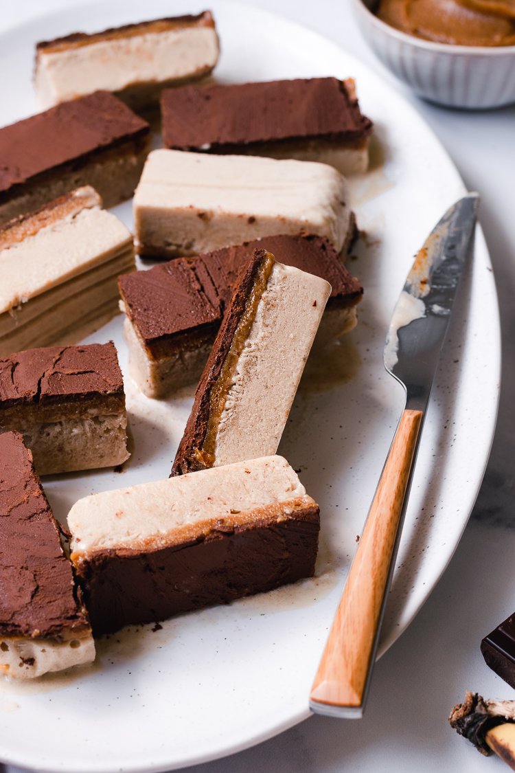 close up of vegan caramel ice cream bars on a plate