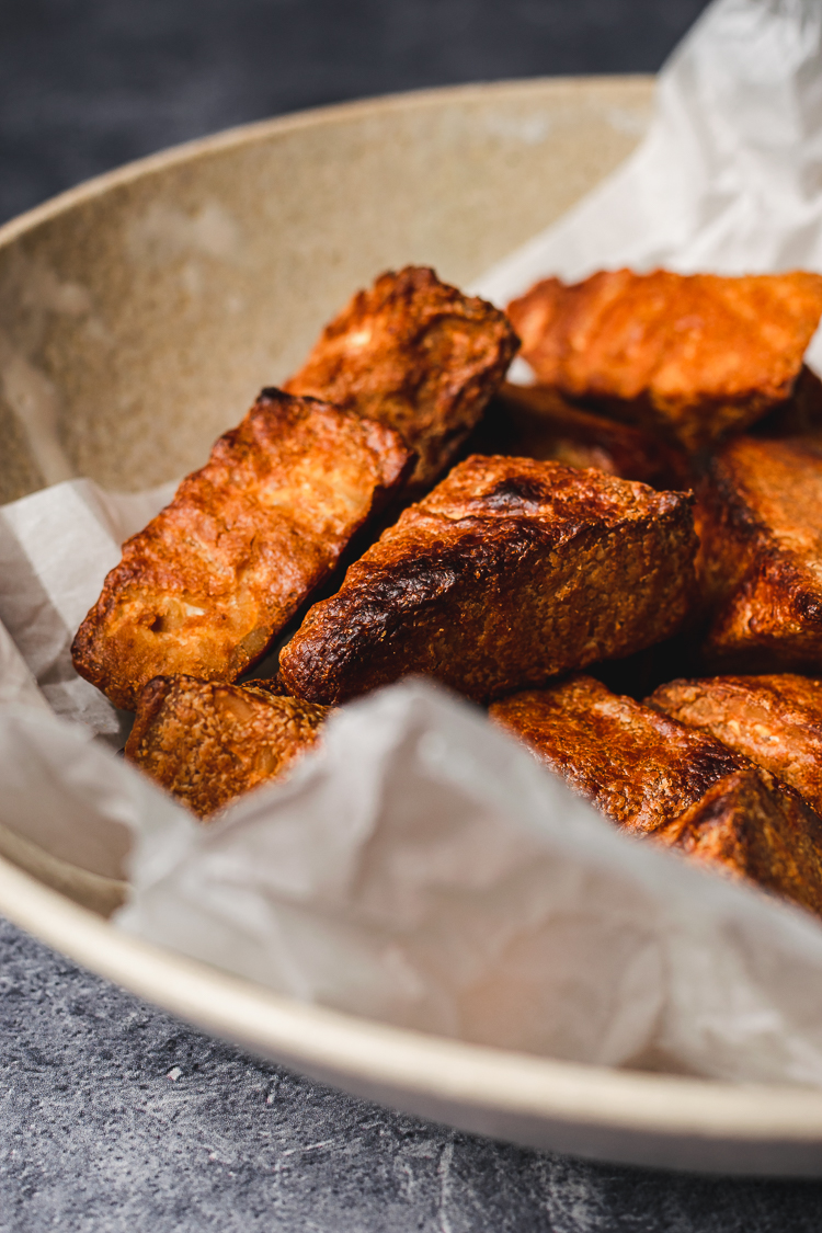 close up of baked hoisin peanut tempeh in a bowl