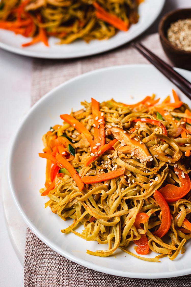 close up of edamame noodle stir fry on plate