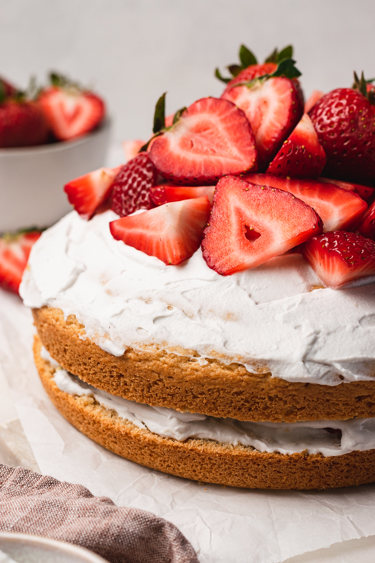 close up of vegan strawberries and cream cake