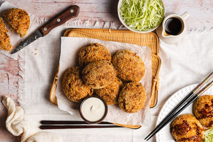 white bean korokke on a plate with mayo and worcestershire sauce