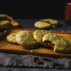 vegan matcha chocolate chunk cookies arranged on a serving tray