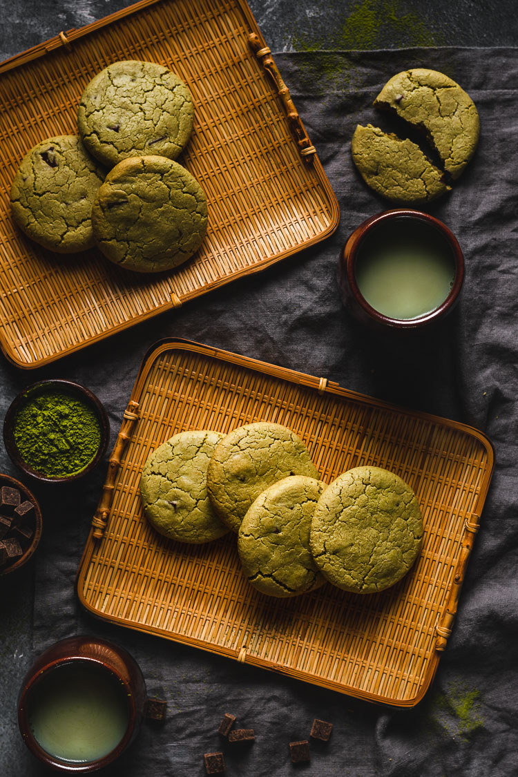 vegan matcha cookies arranged on platters, served with hot matcha tea