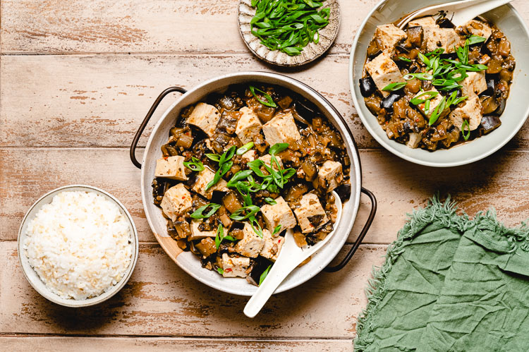 vegan mapo tofu in a bowl, rice bowl on the side