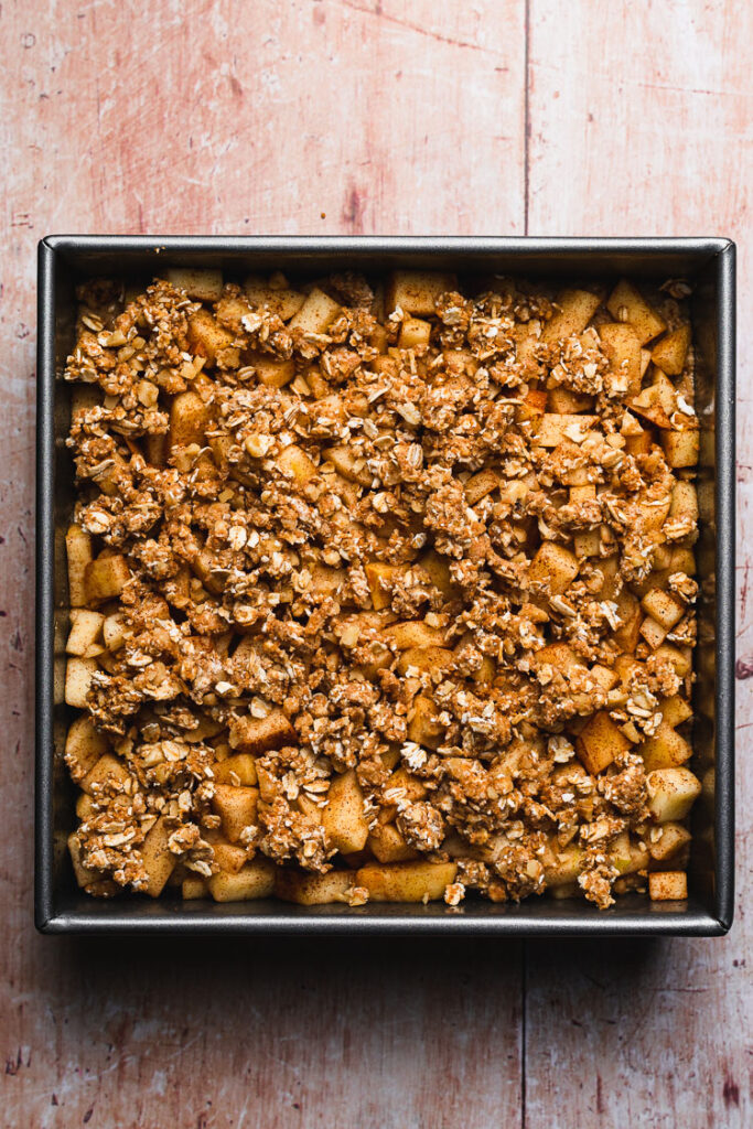 crumb topping added to vegan apple crumb cake prebaking