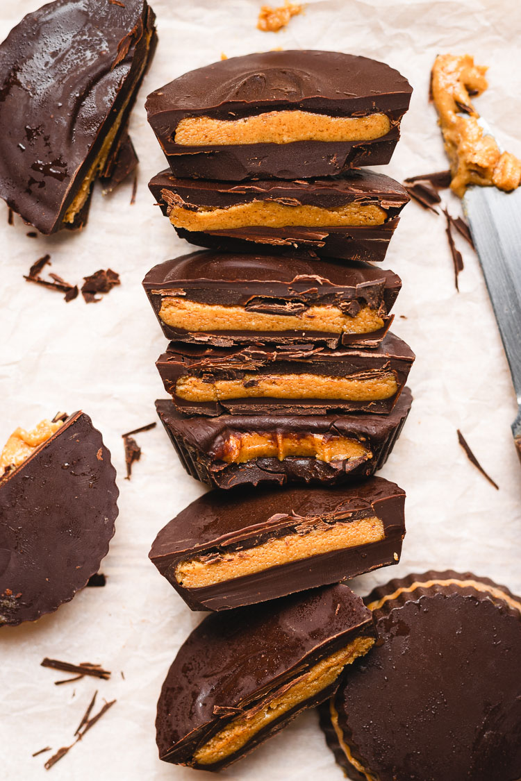 homemade peanut butter cups cut in half, arranged in a line