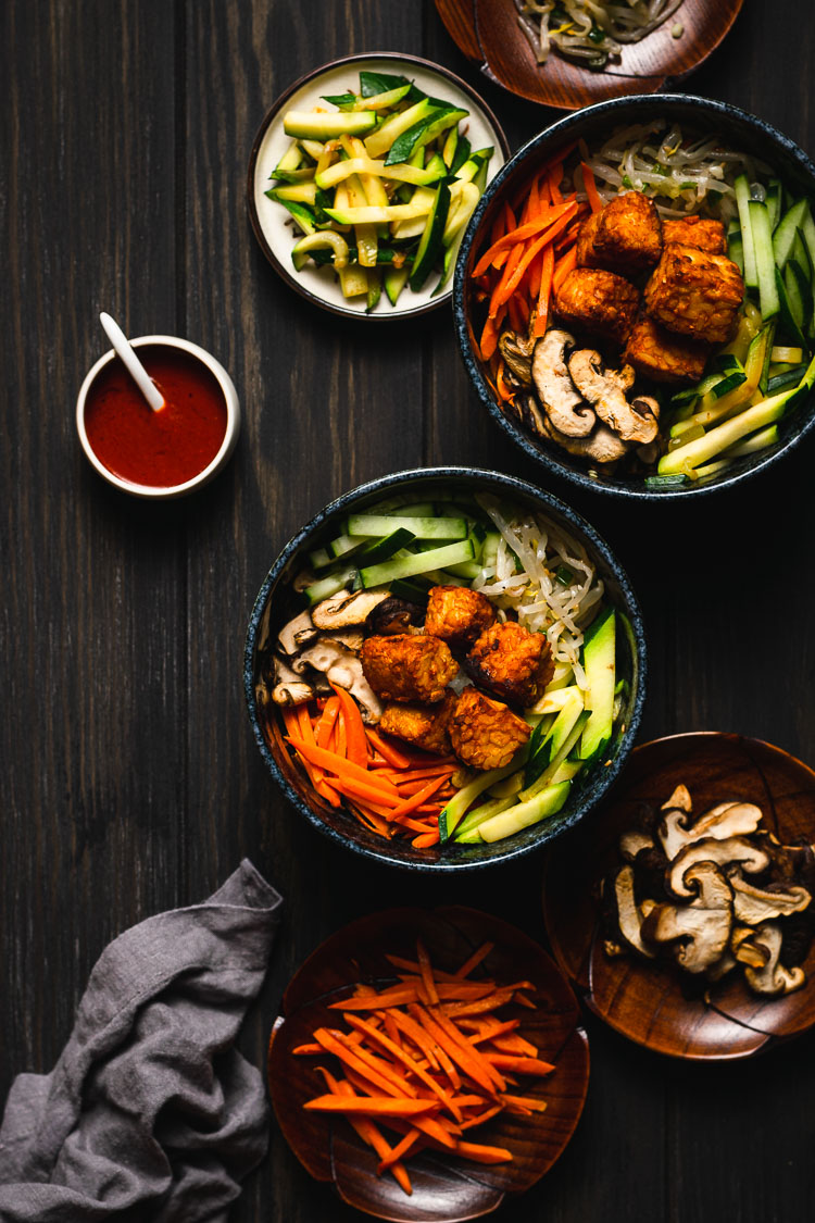 flat lay of two bowls of bibimbap with tempeh