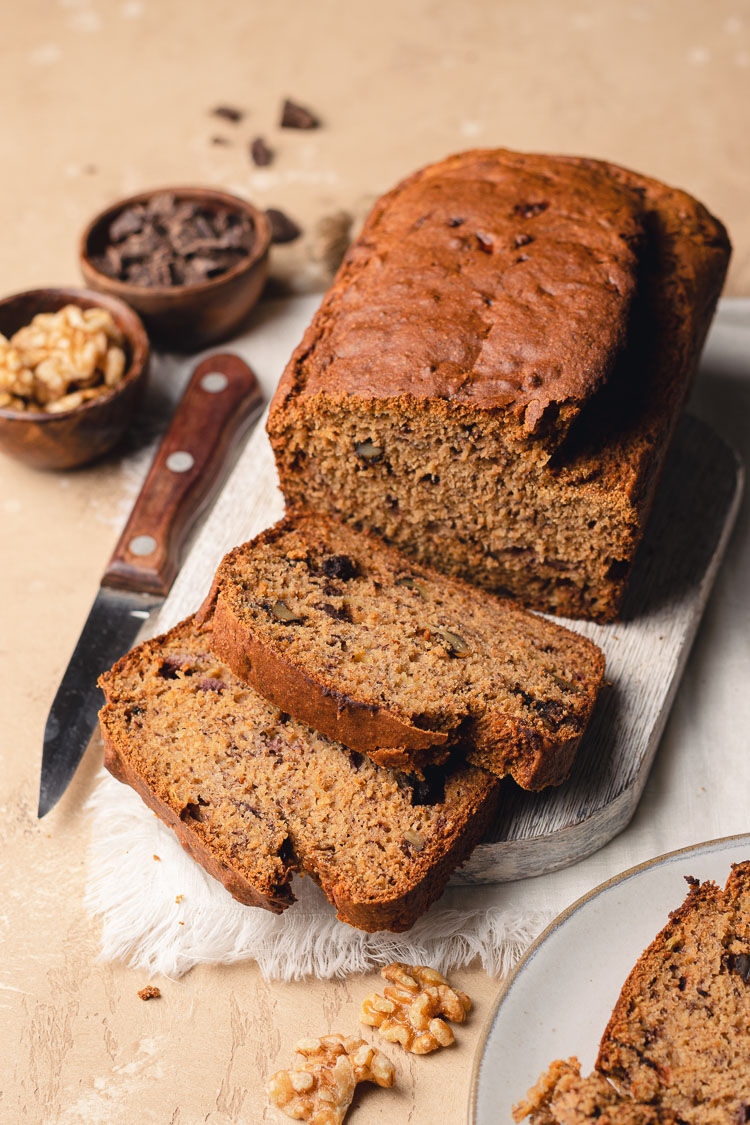 gluten free banana bread sliced, on cutting board