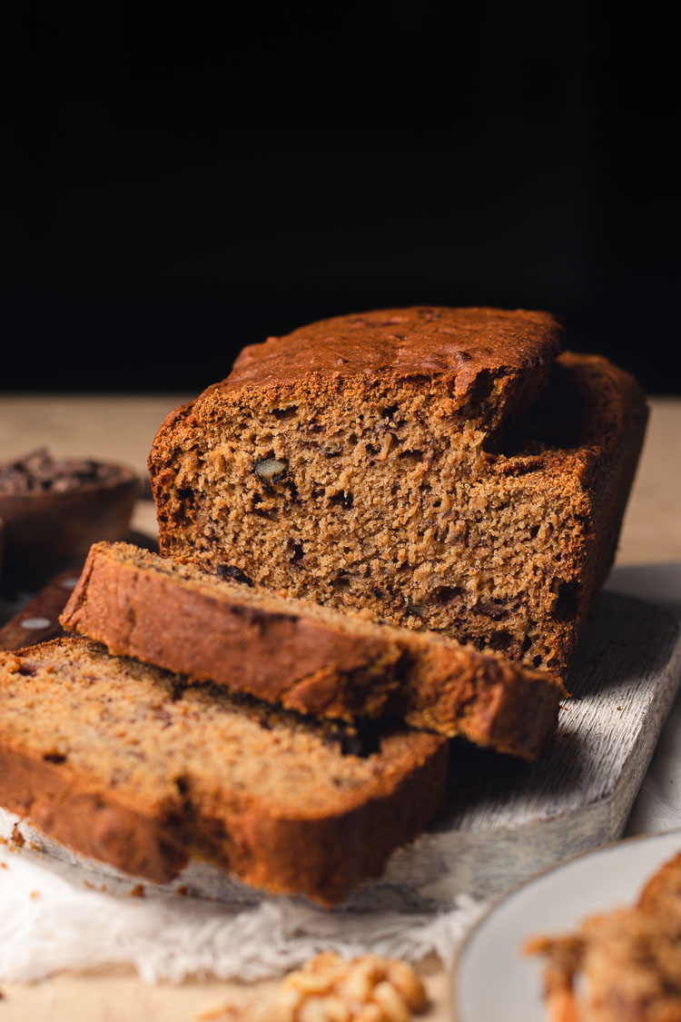 gluten free banana bread sliced on a cutting board