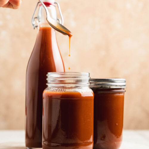 japanese worcestershire sauce dripping from a spoon into a jar