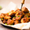 sesame miso potatoes in a skillet with a fork piercing one