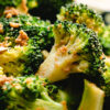close up of broccoli gomaae on a plate