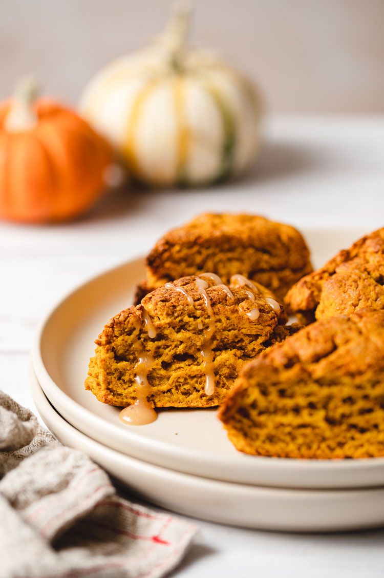 pumpkin scone with maple glaze on a plate