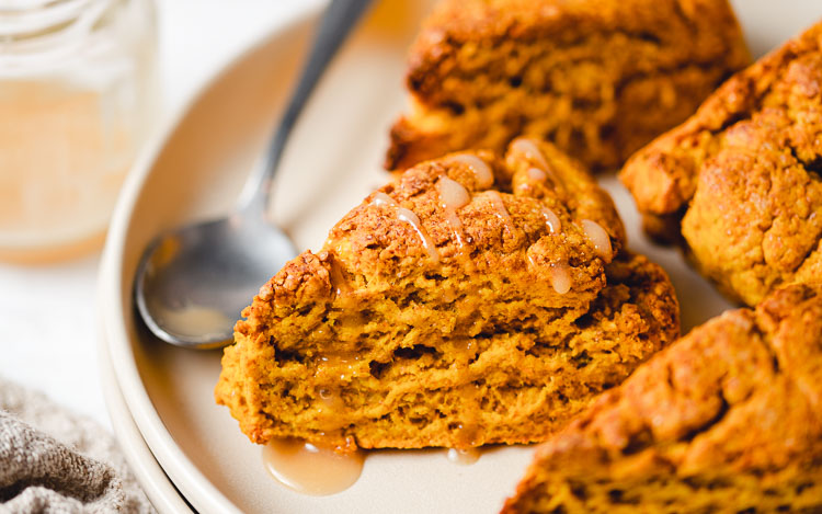 close up of vegan pumpkin scones on a plate