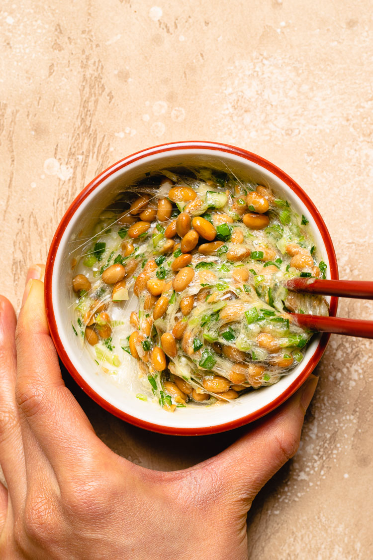mixing natto in a bowl