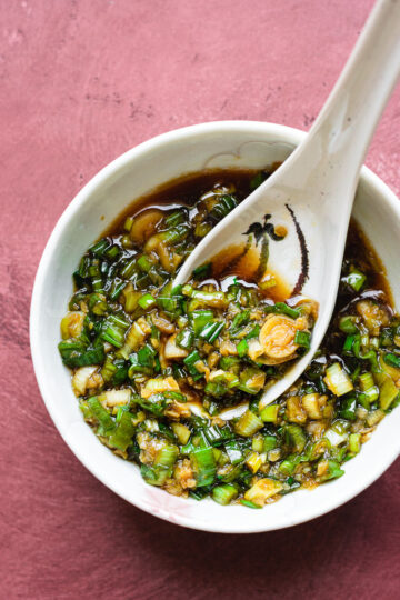 green onion sauce in a bowl with spoon