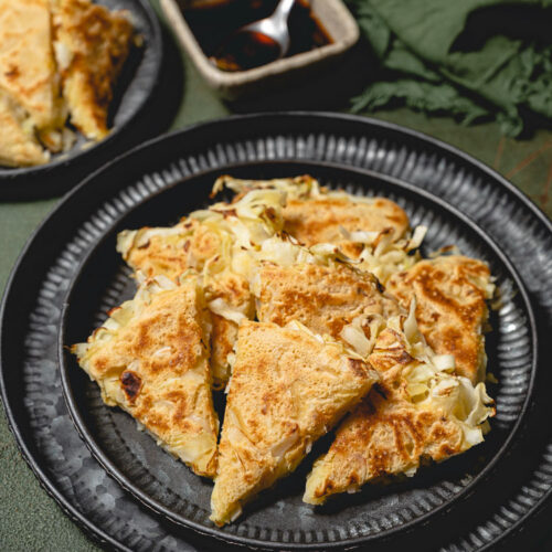 cabbage pancakes cut up on a plate