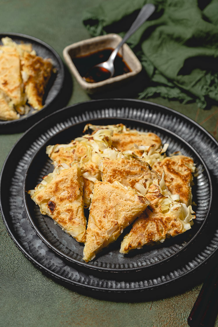 cabbage pancakes cut up on a plate