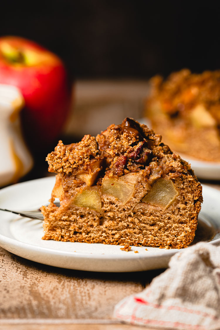 slice of vegan caramel apple cake on a plate