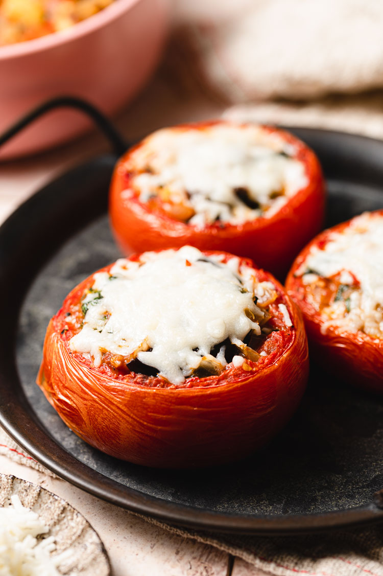 ratatouille stuffed tomatoe on a plate close up