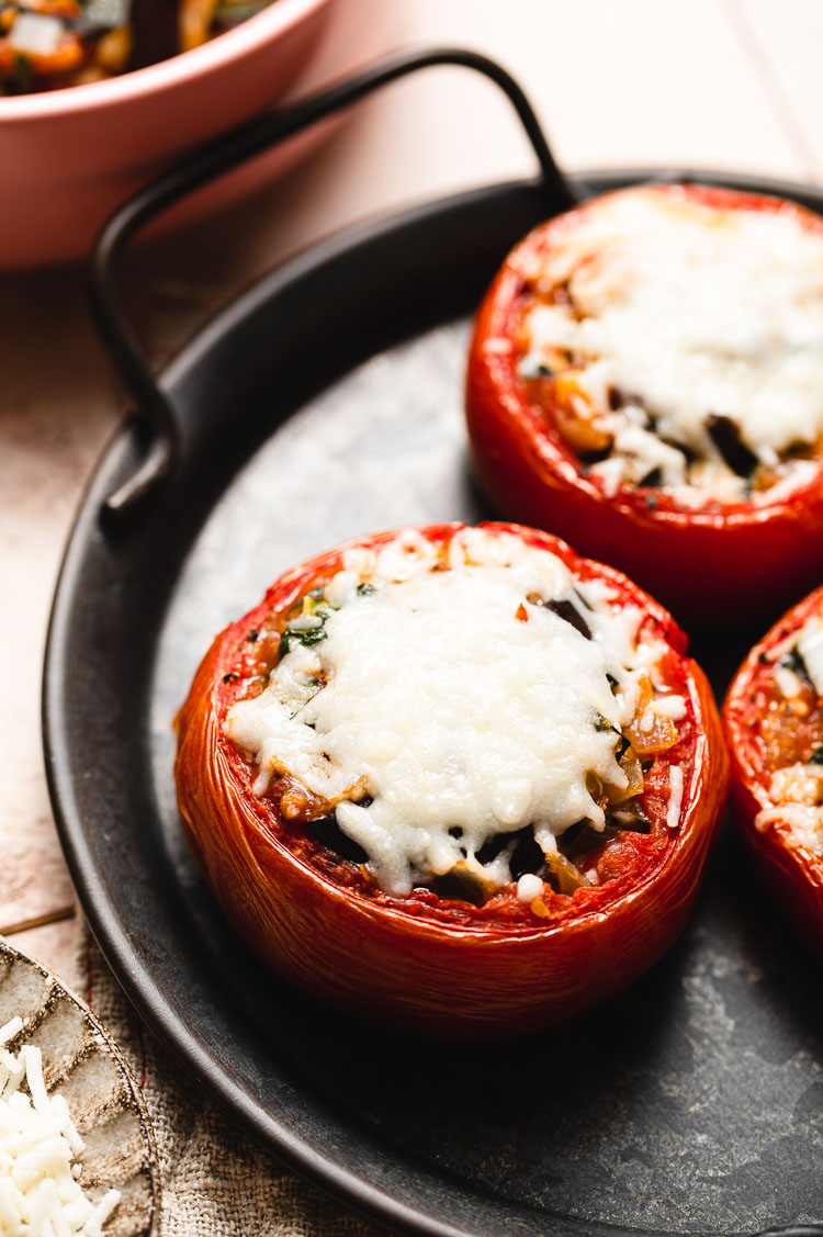 ratatouille stuffed tomatoes on a plate