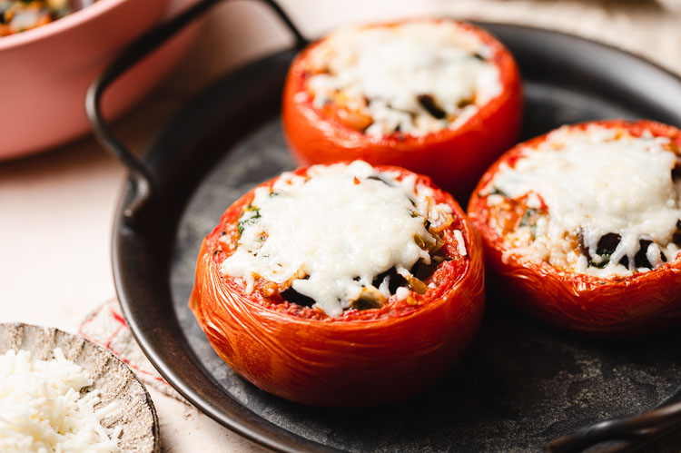 ratatouille stuffed tomatoes on a plate