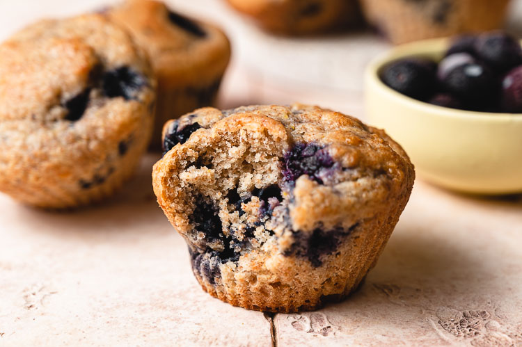 blueberry muffin with bite taken out of it