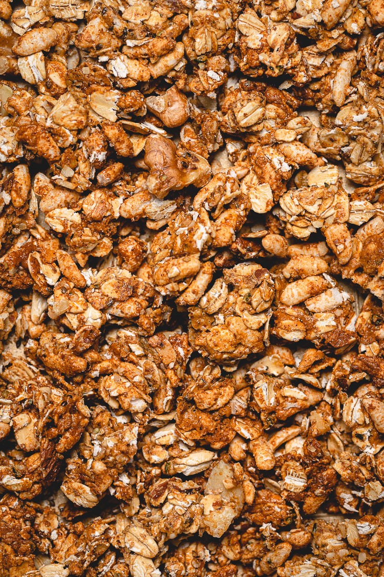 close up of vegan maple granola on a baking sheet