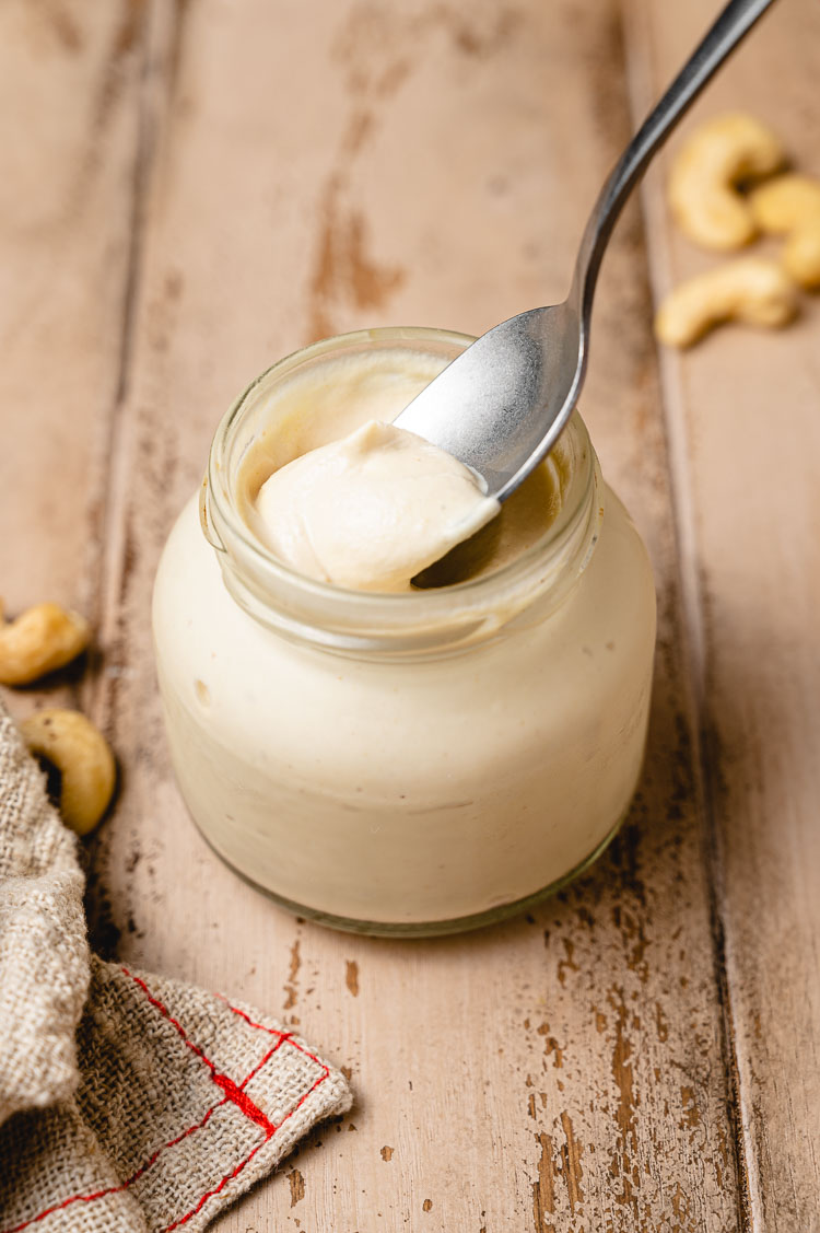 spoon in a jar of vegan mayo