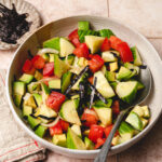 cucumber ponzu salad in a bowl with spoon