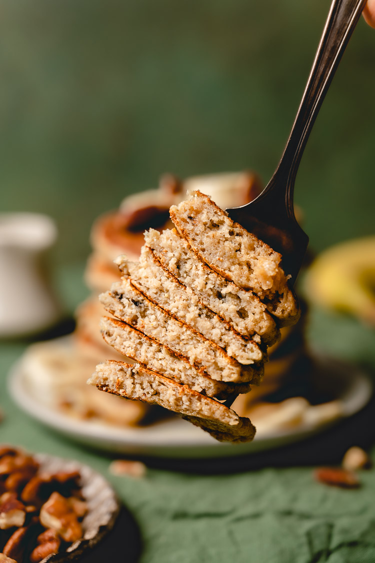 close up bite of banana pancake stack