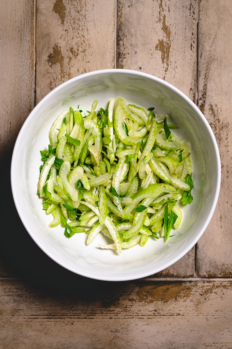 a bowl of salted celery