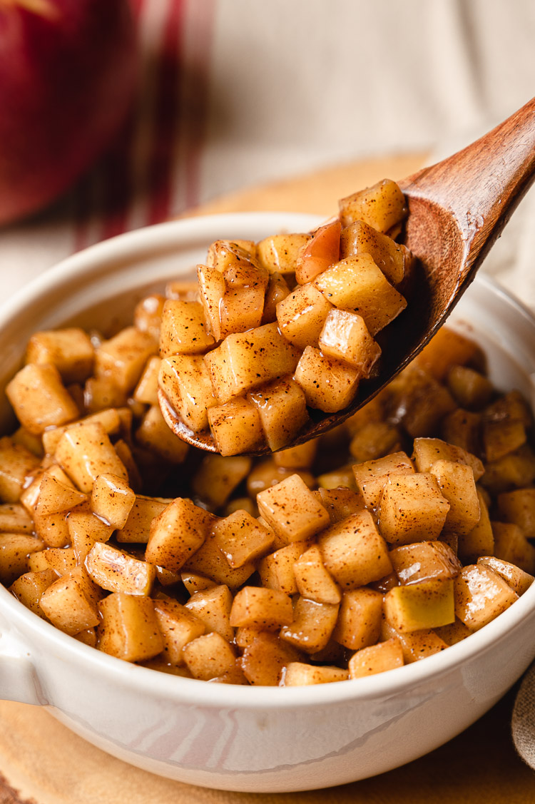 close up spoonful of stewed apples