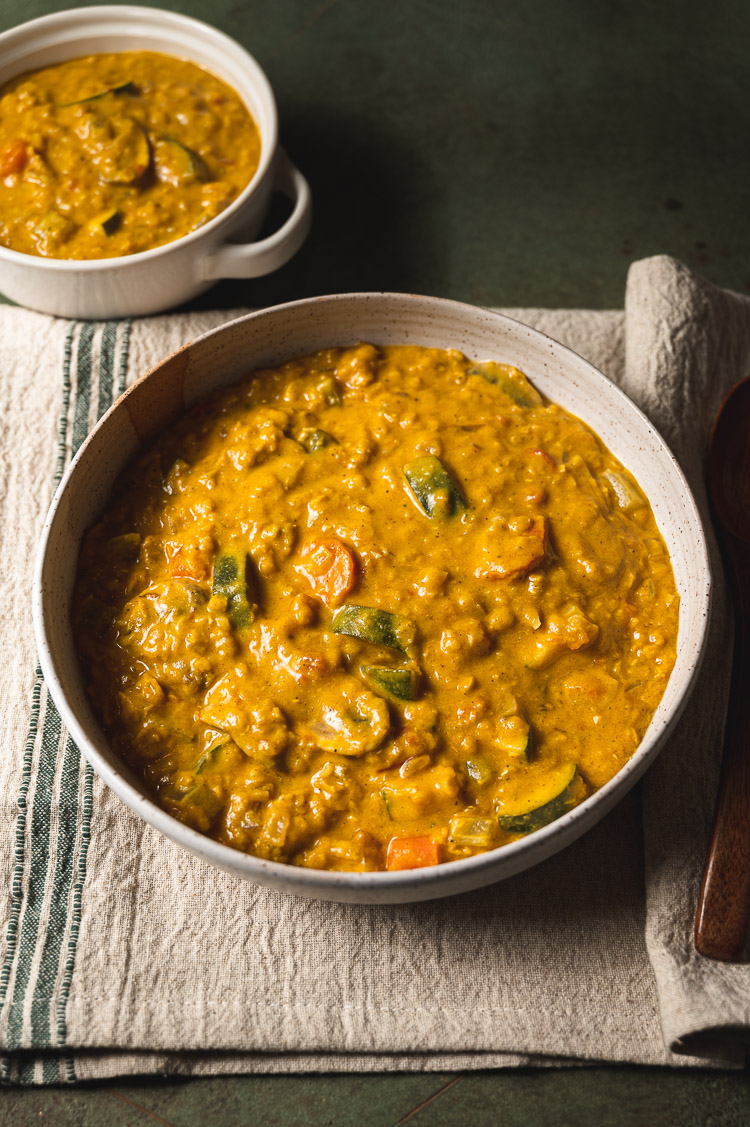 big bowl of kabocha curry with small bowl in background