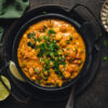 bowl of tempeh chickpea peanut curry on a platter