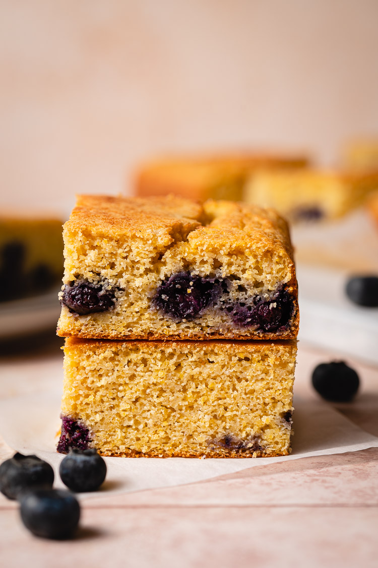 stacked slices of vegan blueberry cornbread