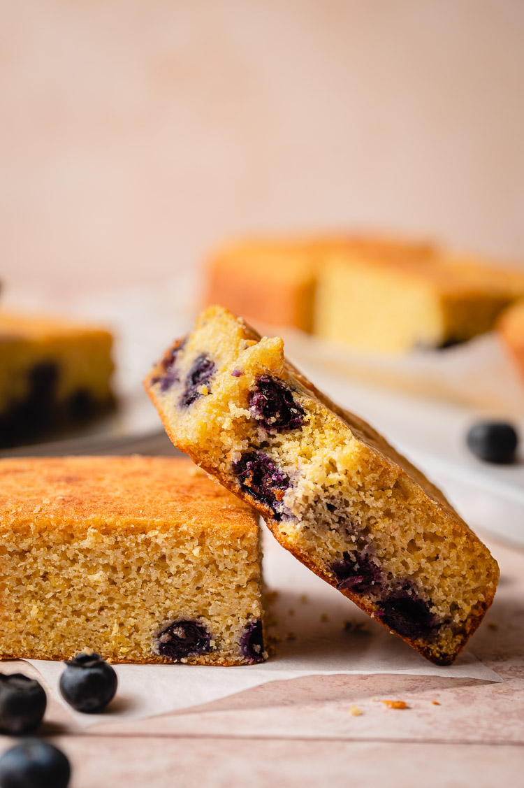 blueberry cornbread with a bite taken out of one slice