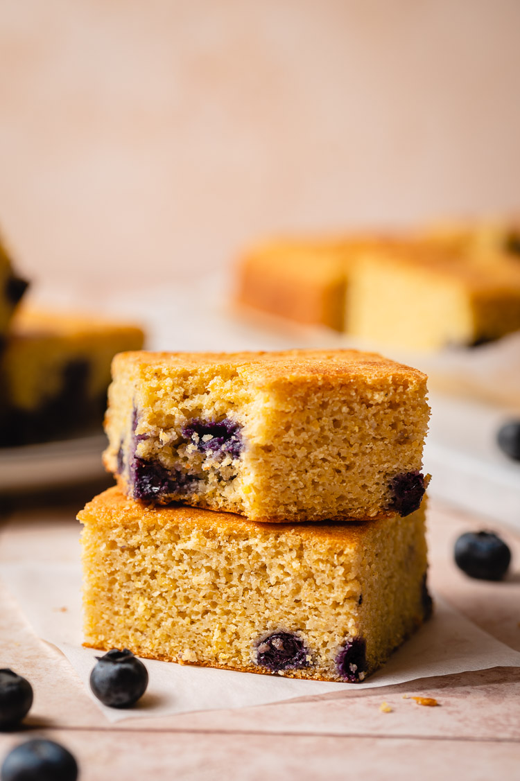 vegan blueberry cornbread with a bite taken out of it